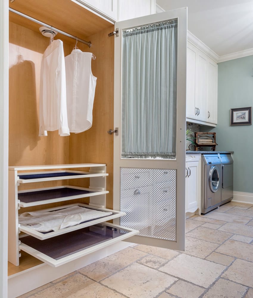 built-in laundry room by Louis L’artisan
