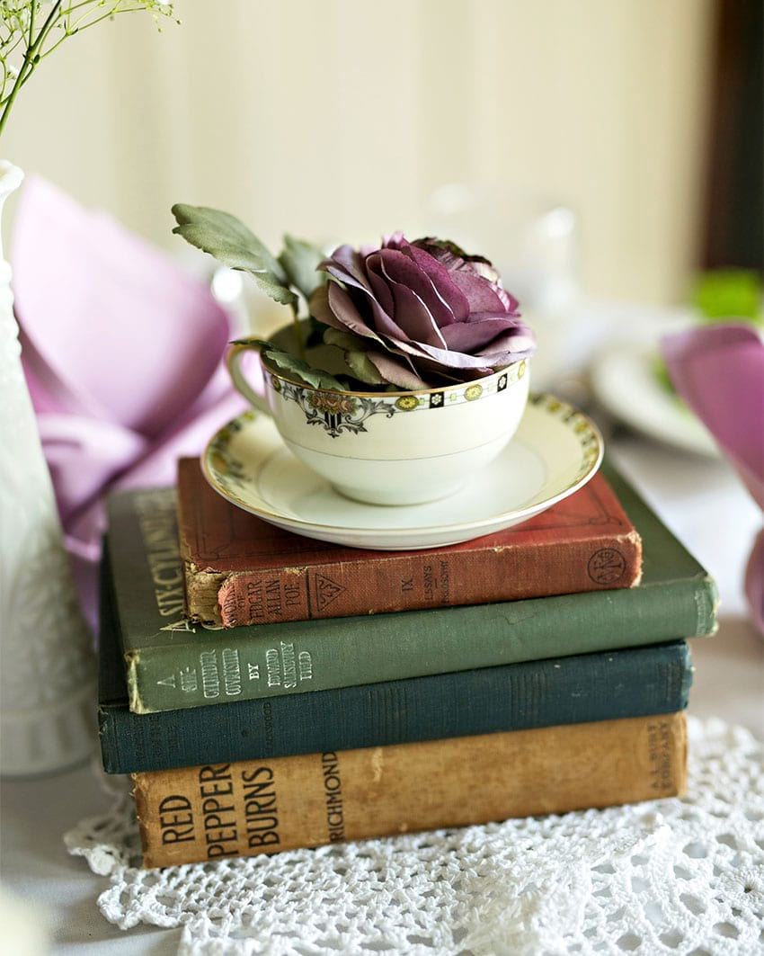 Teacup and book centerpiece, via The Knot